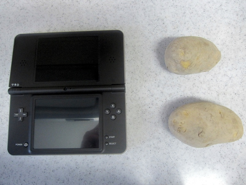 Illustration for article titled Is The DSi LL Bigger Than Uncharted 2, Nolan Ryan's Autograph, A Can of Beer?